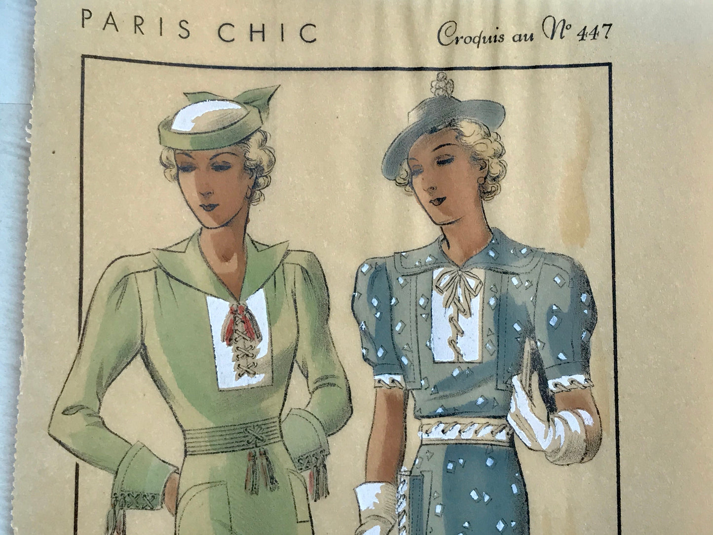 A Sketch, or Croquis. Produced by the Fashion House of Maurice Dubois. Hand coloured lithograph. 1935. Size: 27.5 x 16.7 cms.