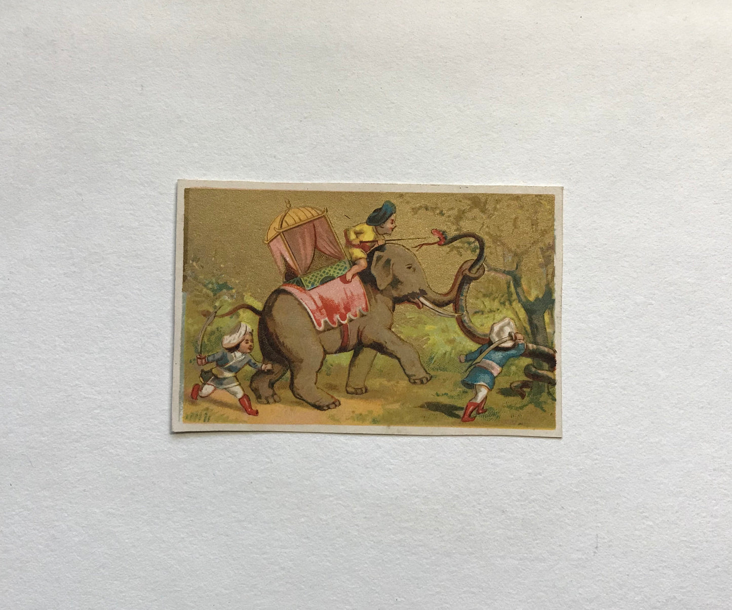 A Set of 6 French Trade Cards. Featuring the adventures of three mahouts and an elephant. Late 19th century. Size: 10 x 6.4 cms.