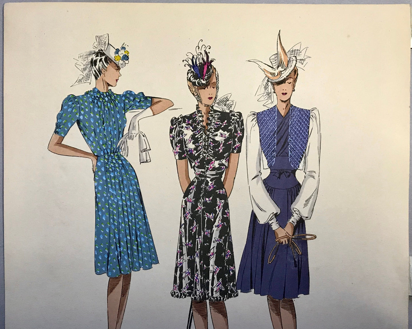 An Original Fashion Sketch, or Croquis, from ‘Les Creations Parisiennes’. A Hand Coloured Lithograph Print. 1945. Large: 32.5 x 24.8 cms.