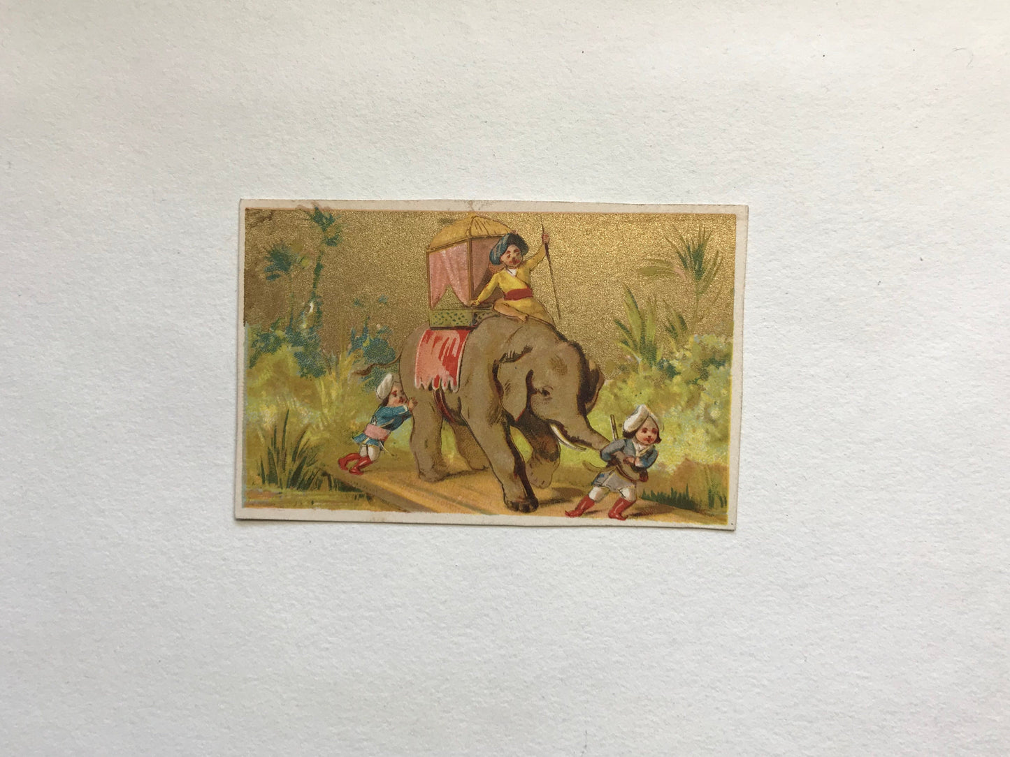A Set of 6 French Trade Cards. Featuring the adventures of three mahouts and an elephant. Late 19th century. Size: 10 x 6.4 cms.
