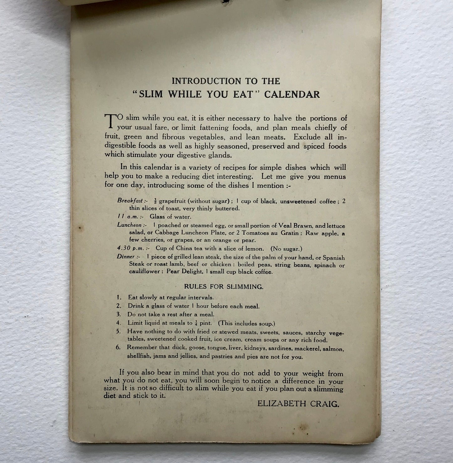 Slim While You Eat! A Calendar with over 100 Recipes. By Elizabeth Craig. Published by G. Delgado Ltd in 1940. 21 x 14 cms. A rare book.