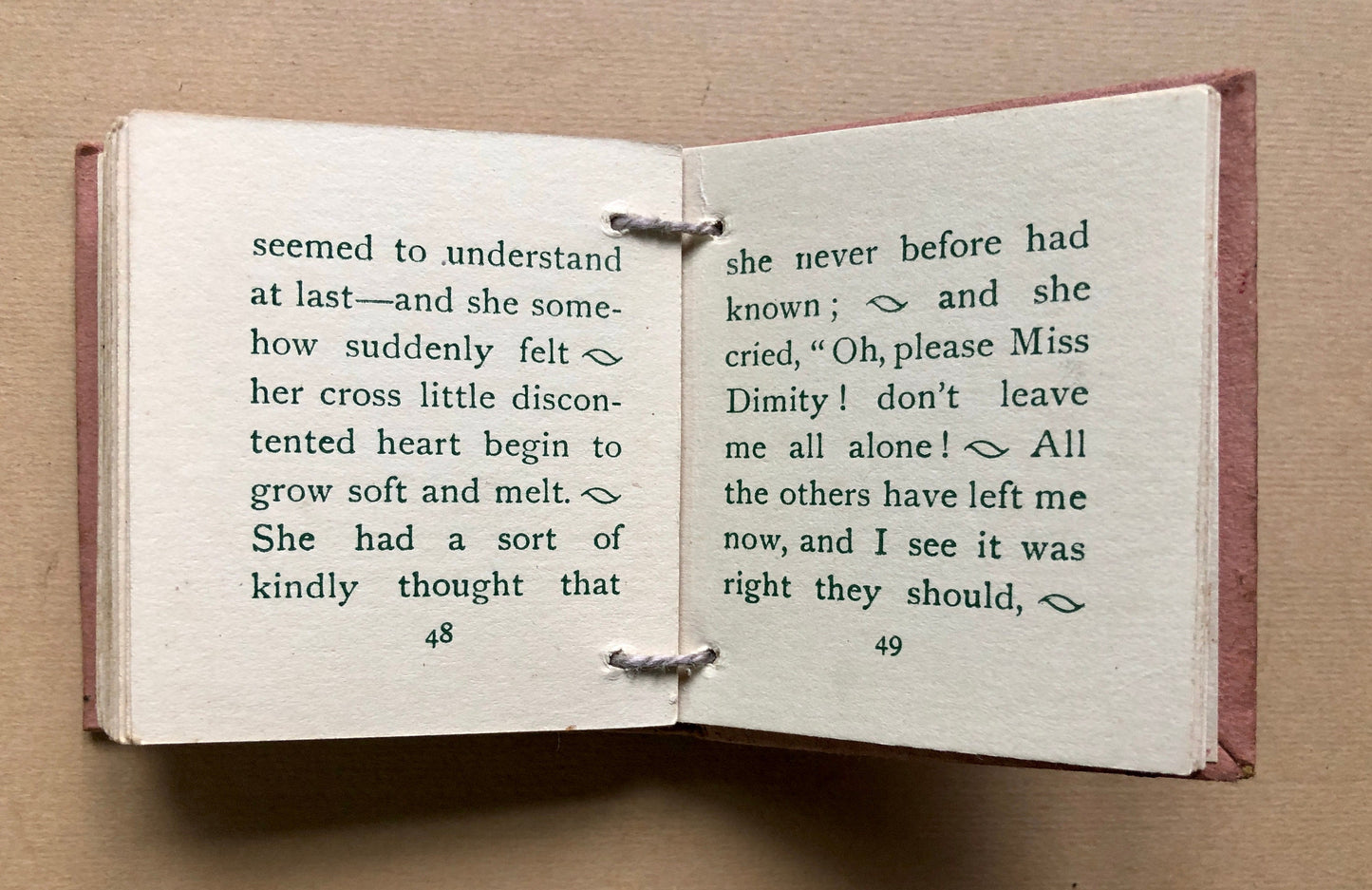 The Doll in Dimity. A Tiny Book in a Slipcase. Published by Humphrey Milford. Undated but known to be 1910. 64 Pages. Size: 6 x 5.5 cms.
