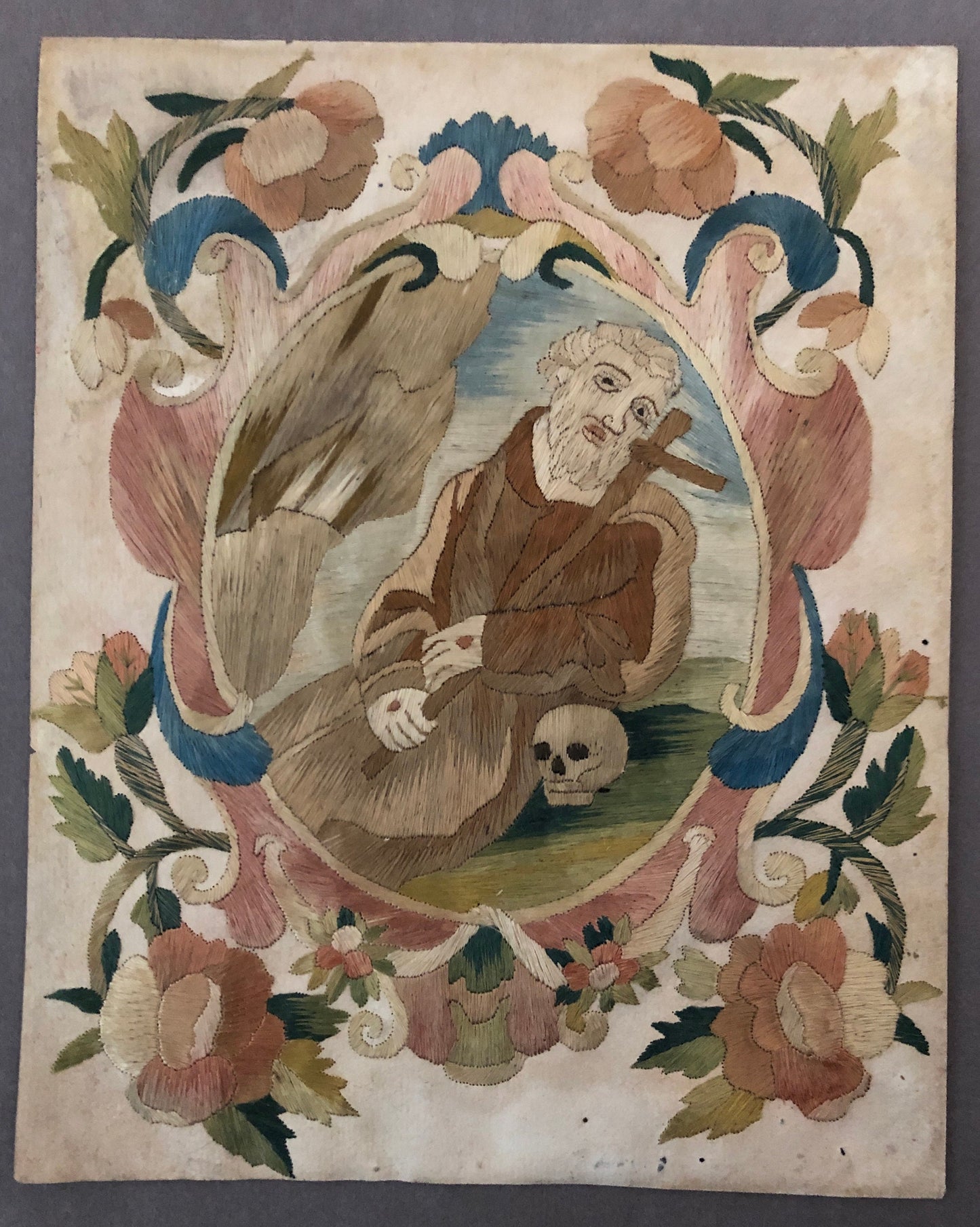 A Fine Silk Double Sided Embroidery of a Saint, Possibly St. Francis, With Skull and Stigmata. French 17th Century. 20 x 16 cms.