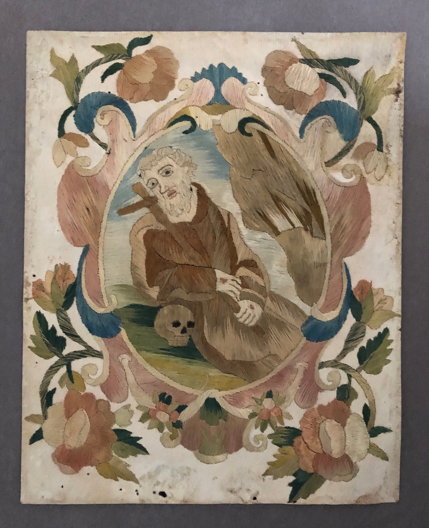 A Fine Silk Double Sided Embroidery of a Saint, Possibly St. Francis, With Skull and Stigmata. French 17th Century. 20 x 16 cms.
