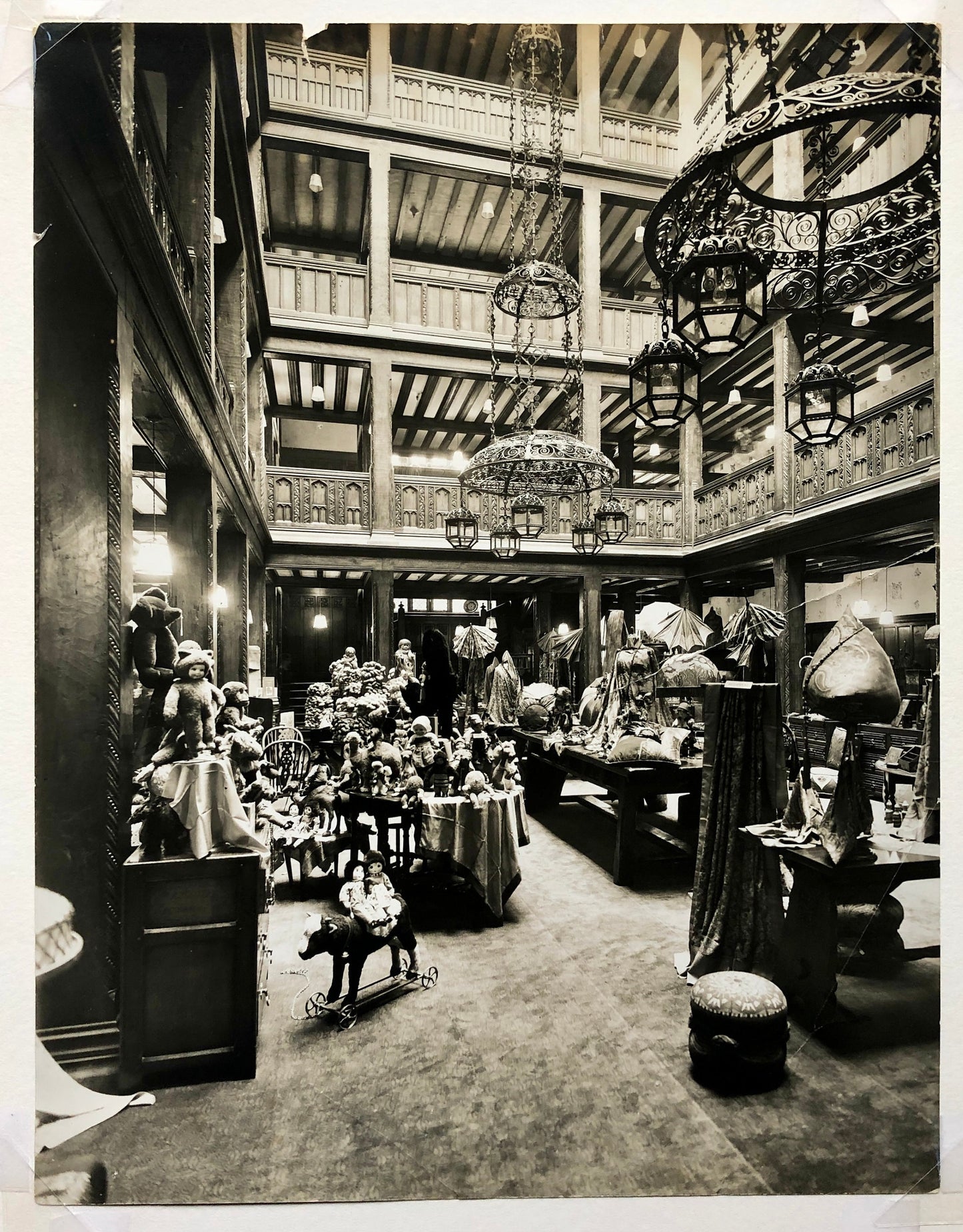 Four Original Sepia Toned Photographs of Liberty Department Store. Exterior and Interior. Dating from the 1920’s. Size: 28.5 x 4 cms.