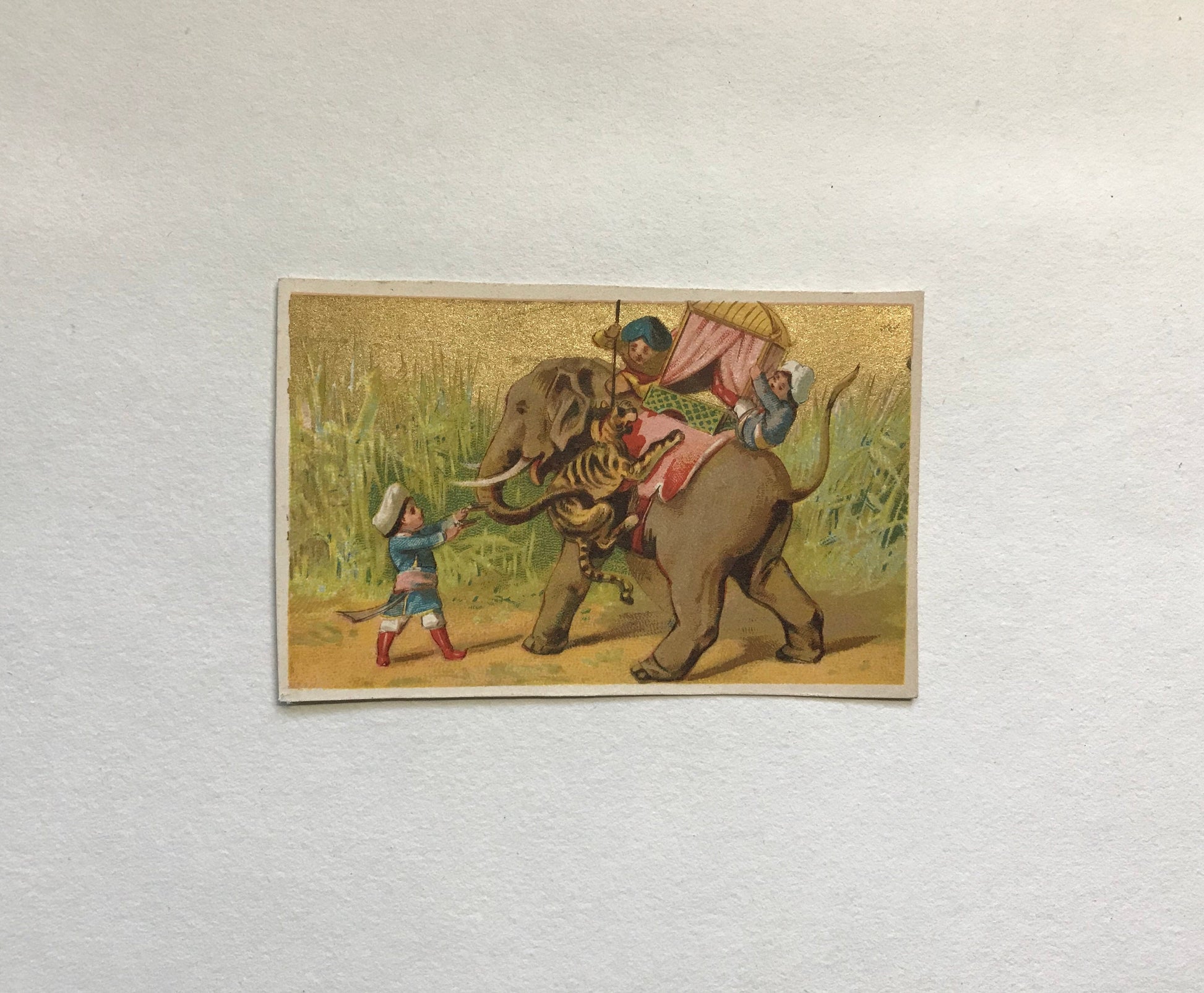 A Set of 6 French Trade Cards. Featuring the adventures of three mahouts and an elephant. Late 19th century. Size: 10 x 6.4 cms.