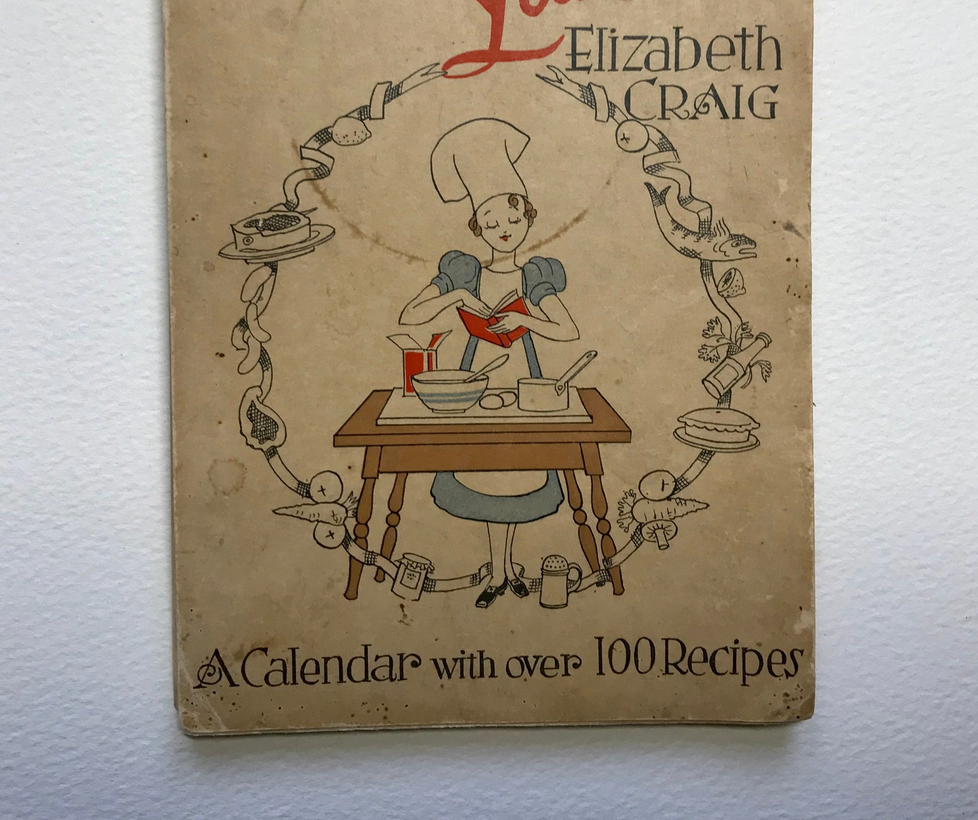 Slim While You Eat! A Calendar with over 100 Recipes. By Elizabeth Craig. Published by G. Delgado Ltd in 1940. 21 x 14 cms. A rare book.