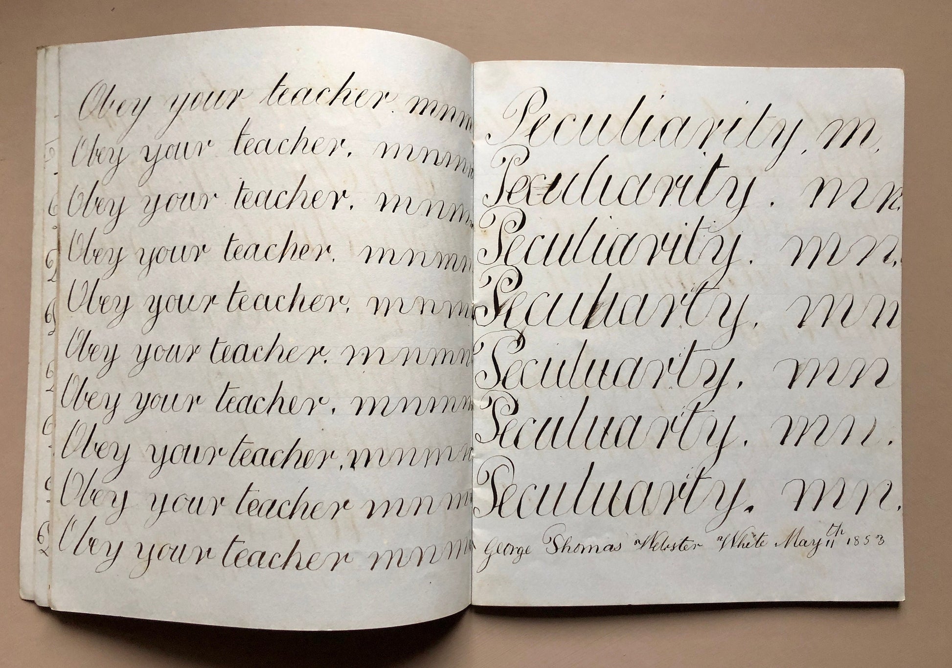 Calligraphy. An Exercise Book in Which Master George Thomas Webster White Practices Penmanship. Dated 1853. 48 pages. Size: 22.7 x 18.3