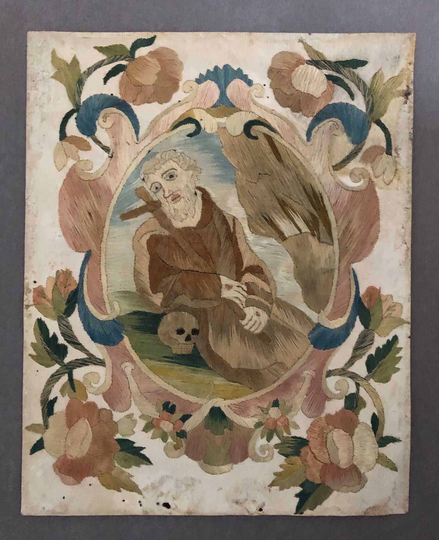 A Fine Silk Double Sided Embroidery of a Saint, Possibly St. Francis, With Skull and Stigmata. French 17th Century. 20 x 16 cms.