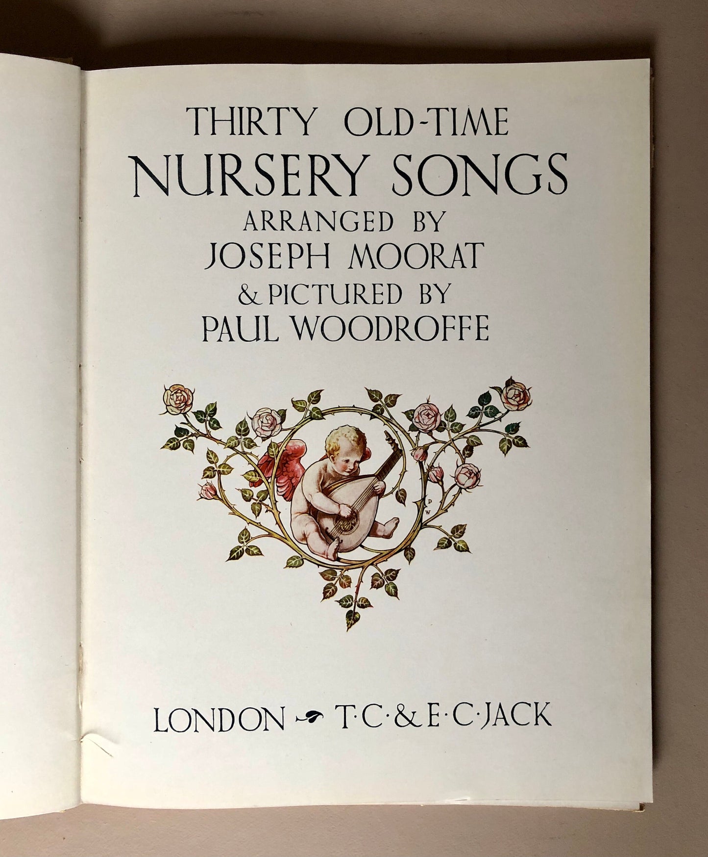 Sing A Song of Sixpence. Thirty Old-Time Nursery Songs. With 40 pictures in colour by Paul Woodroffe. Published in . Size: 31 x 24 cms.