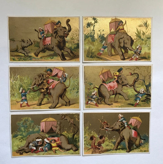 A Set of 6 French Trade Cards. Featuring the adventures of three mahouts and an elephant. Late 19th century. Size: 10 x 6.4 cms.