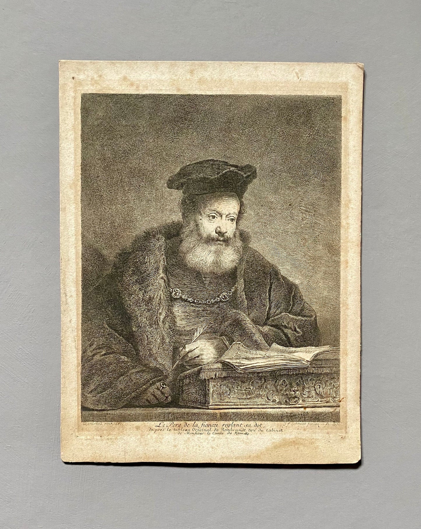 An Engraving of a Painting by Rembrandt Van Riijn (1606 - 1669) Entitled The Father of The Bride. Dated 1770. Size: 22.2 x 27 cms.