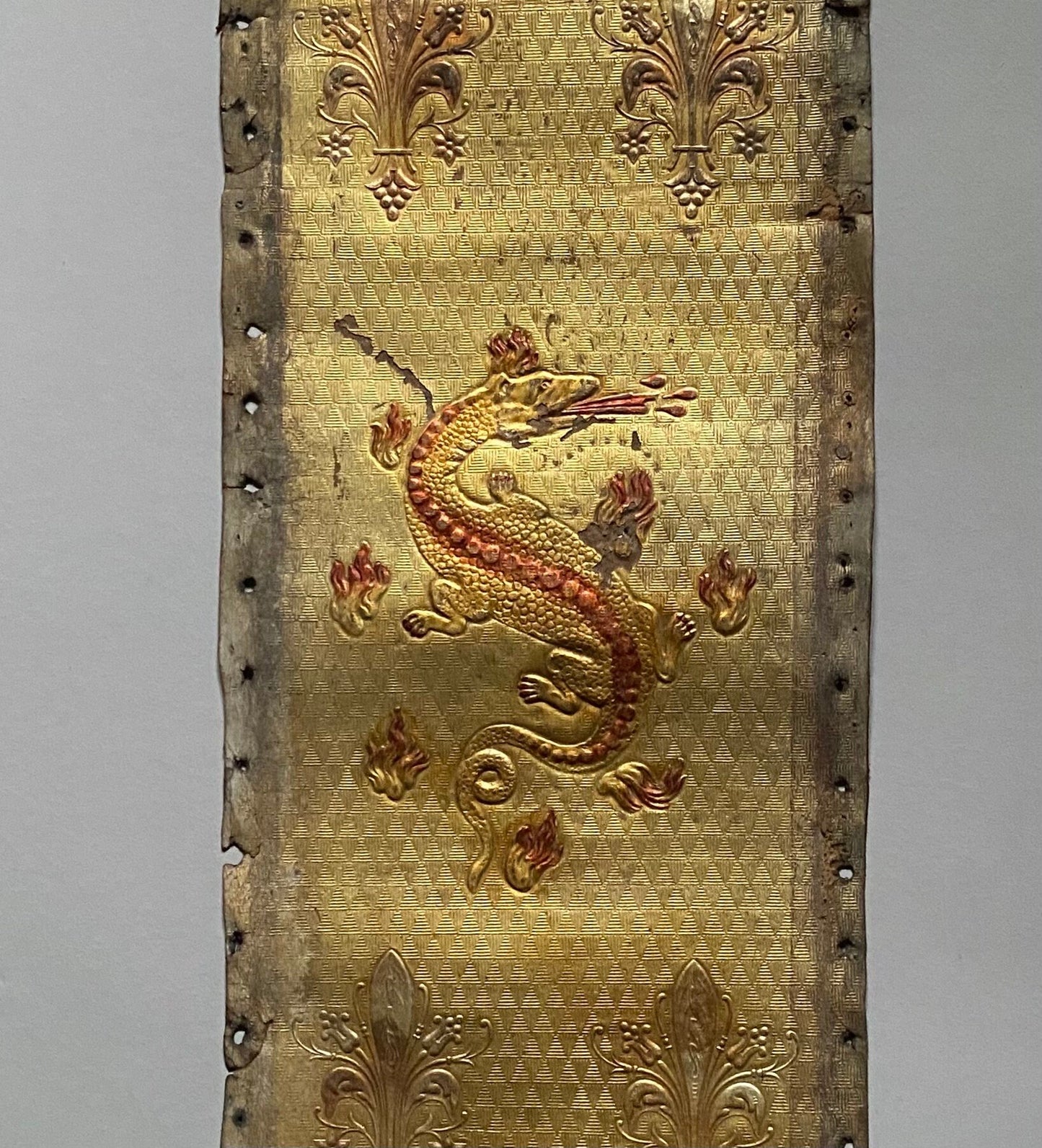 Two Long Lengths of Gilded Antique Leather Decorated With Bronze Dragons and Siver Fleur de Lis. French. Size: 9.5 meters in length.