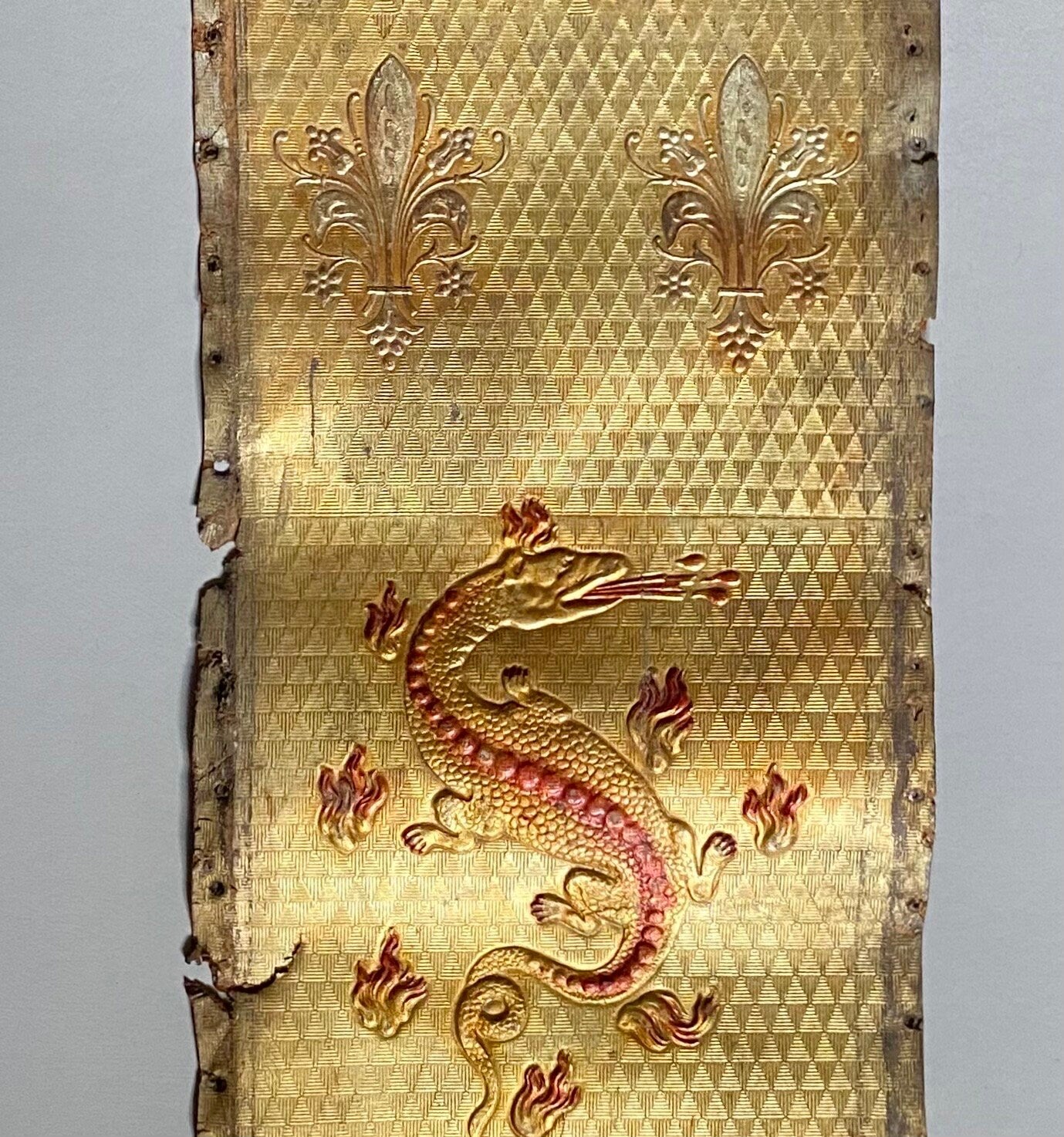 Two Long Lengths of Gilded Antique Leather Decorated With Bronze Dragons and Siver Fleur de Lis. French. Size: 9.5 meters in length.