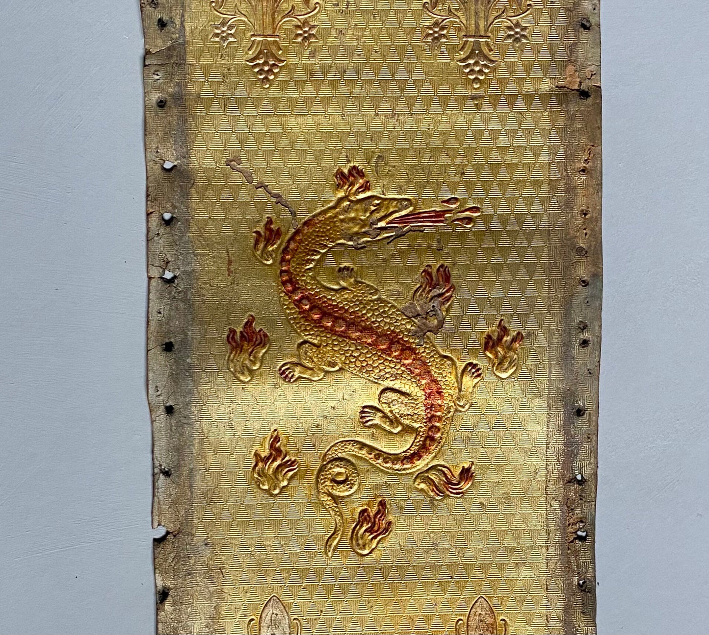 Two Long Lengths of Gilded Antique Leather Decorated With Bronze Dragons and Siver Fleur de Lis. French. Size: 9.5 meters in length.