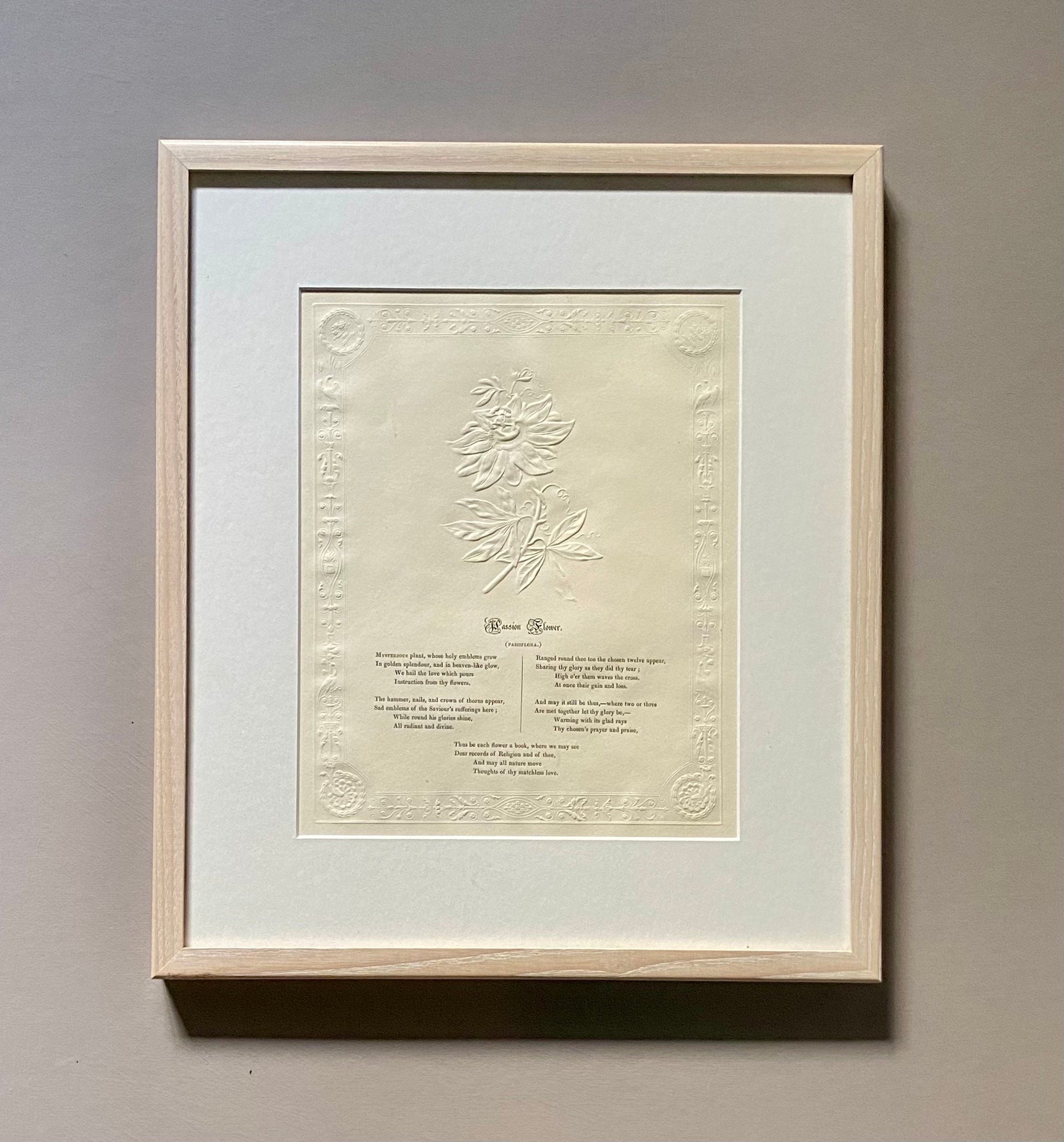 Passion Flower. An Antique Embossed Paper Image. With Poem in Black Script. Framed Using Clear Glass in a Limed Frame. Size: 35 x 30.5 cms.
