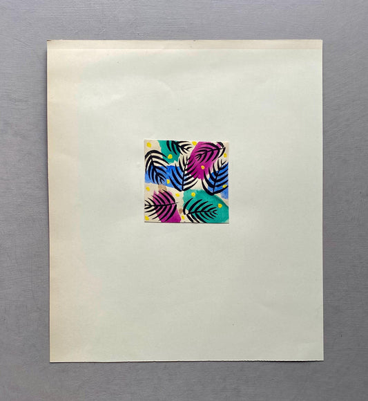 May include: A square artwork featuring a colorful leaf pattern. The leaves are depicted in shades of black, blue, teal, and magenta, with yellow dots. The artwork is centered on a cream-colored paper.