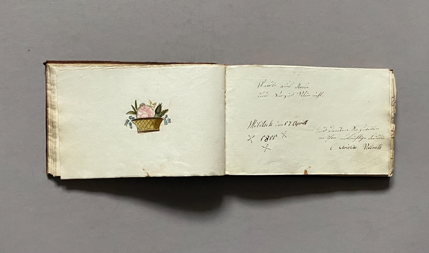 A Leatherbound Autograph Book Containing 5 Watercolours and A Needlework Posy. German. Early 1800s. Size: 12 x 18.5 cms.