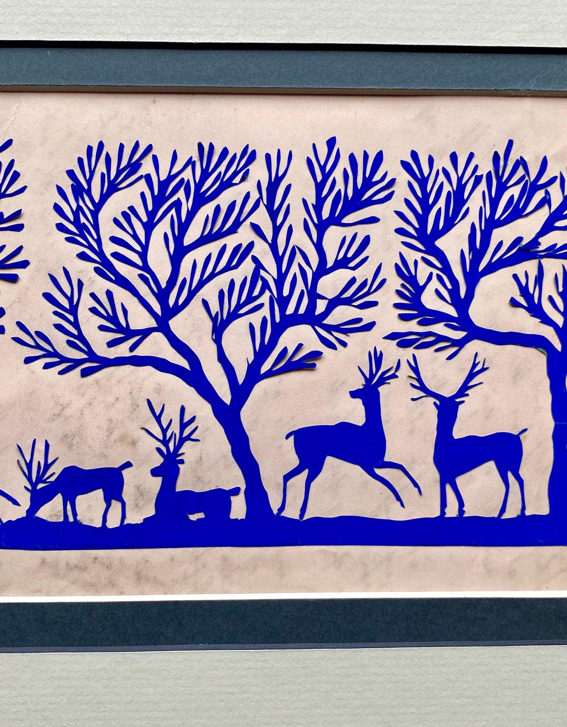 An Antique Paper Cut. Deer In a Wood. Blue on a Pale Pink Ground. Late Georgian, Early Victorian. Size: 12.7 x 21.5 cms.
