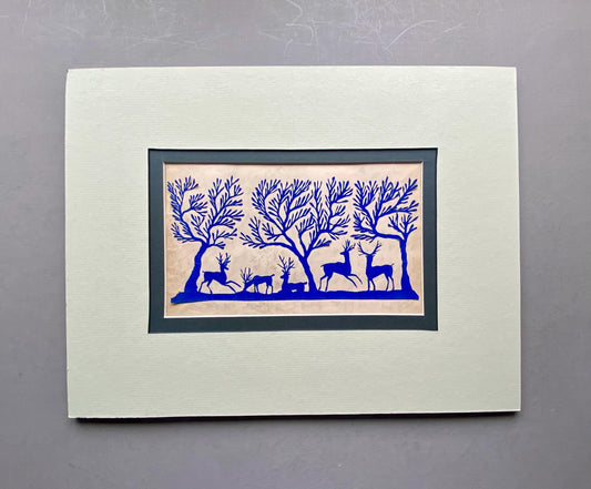 An Antique Paper Cut. Deer In a Wood. Blue on a Pale Pink Ground. Late Georgian, Early Victorian. Size: 12.7 x 21.5 cms.