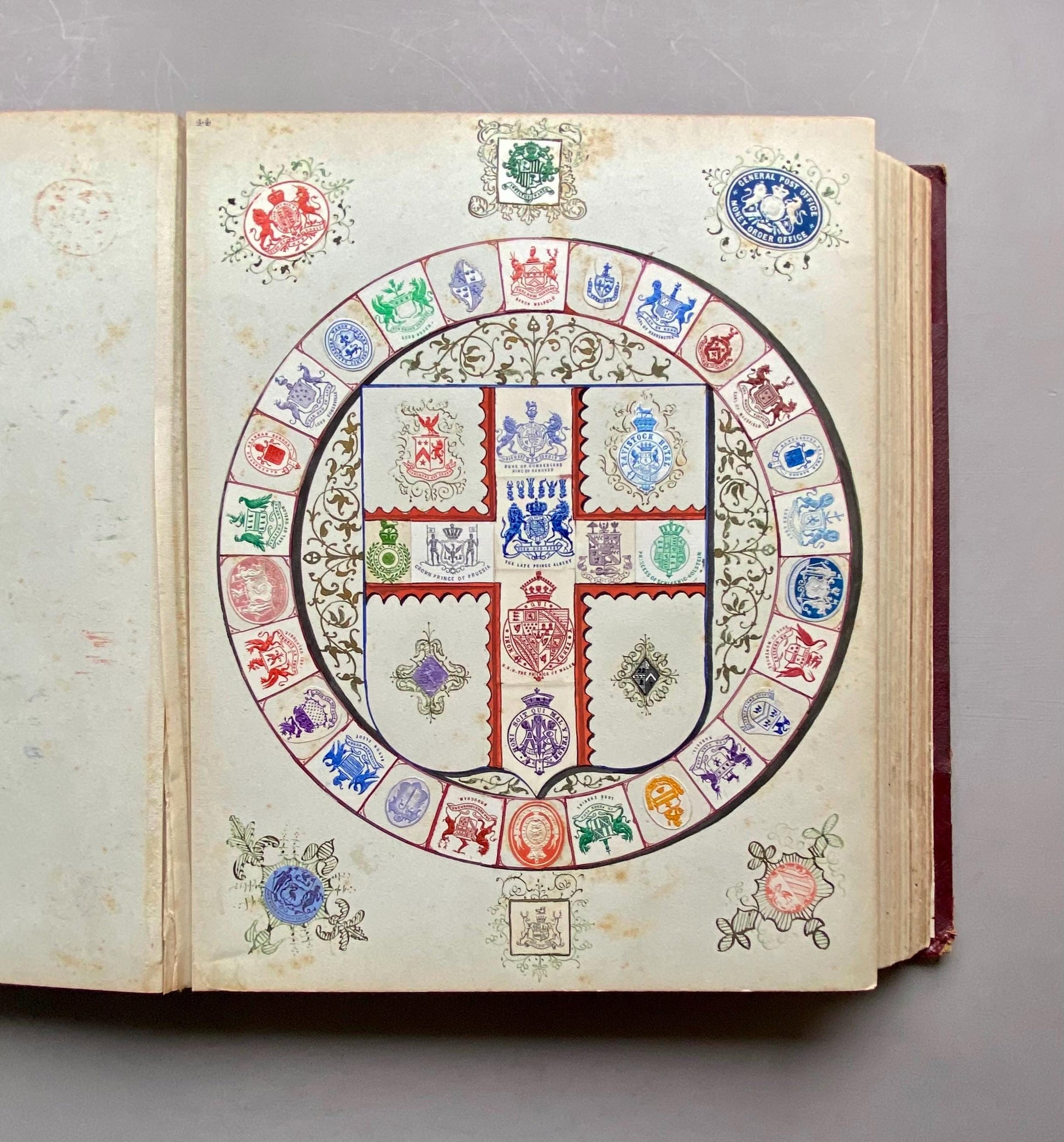 A Crest Album Containing 27 decorated Hand Drawn and Painted Watercolour Images. Undated: Likely 32 x 25 cms.