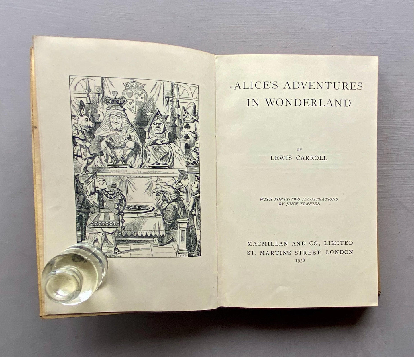 Alice's Adventures in Wonderland by Lewis Carroll. With Illustrations by John Tenniel. Published by Macmillan & Co in 1938.