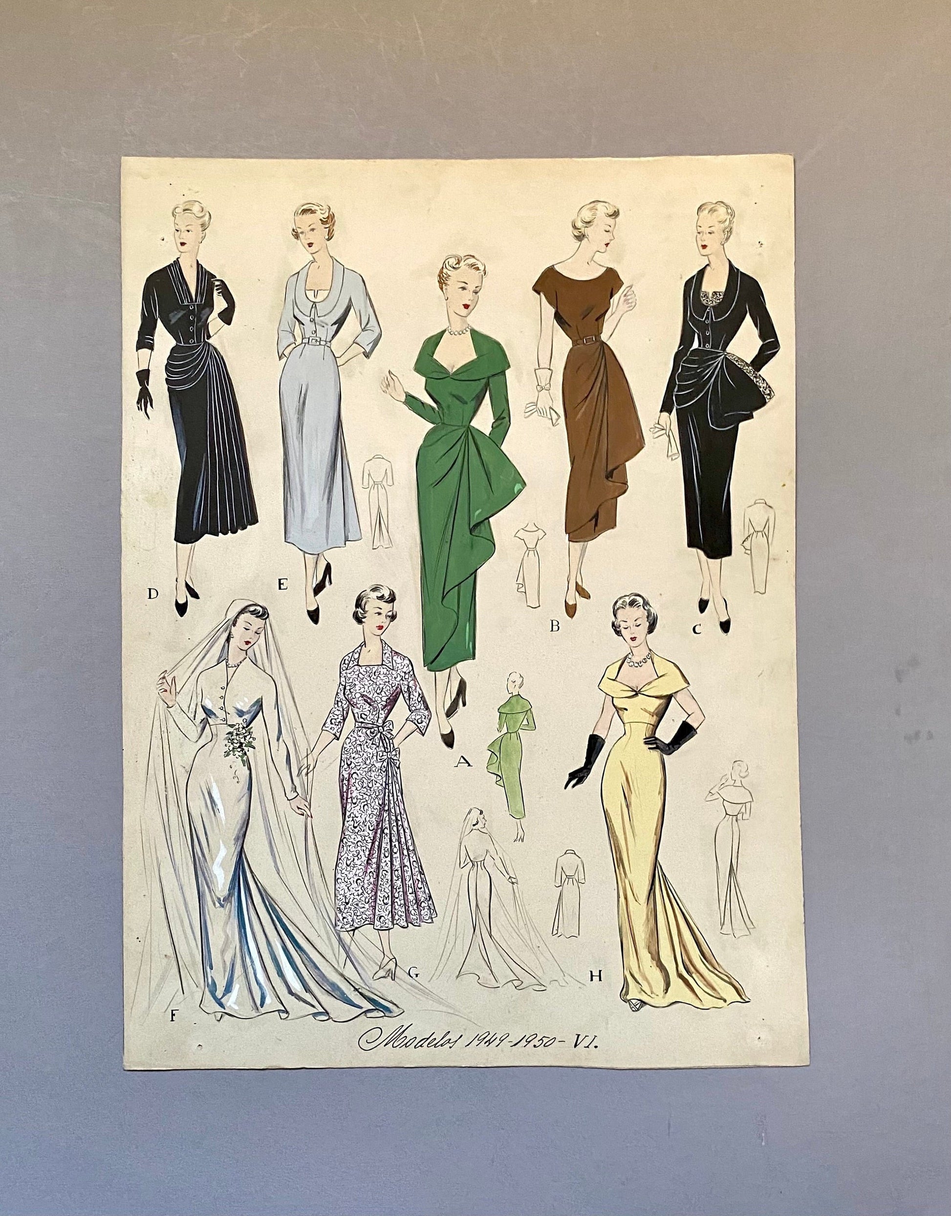 May include: A vintage fashion illustration featuring nine different dress designs for women. The dresses are in various colors and styles, including a black dress with a bow, a green dress with a draped skirt, and a yellow dress with a long train. The illustration is titled "Models 1949-1950-VI."