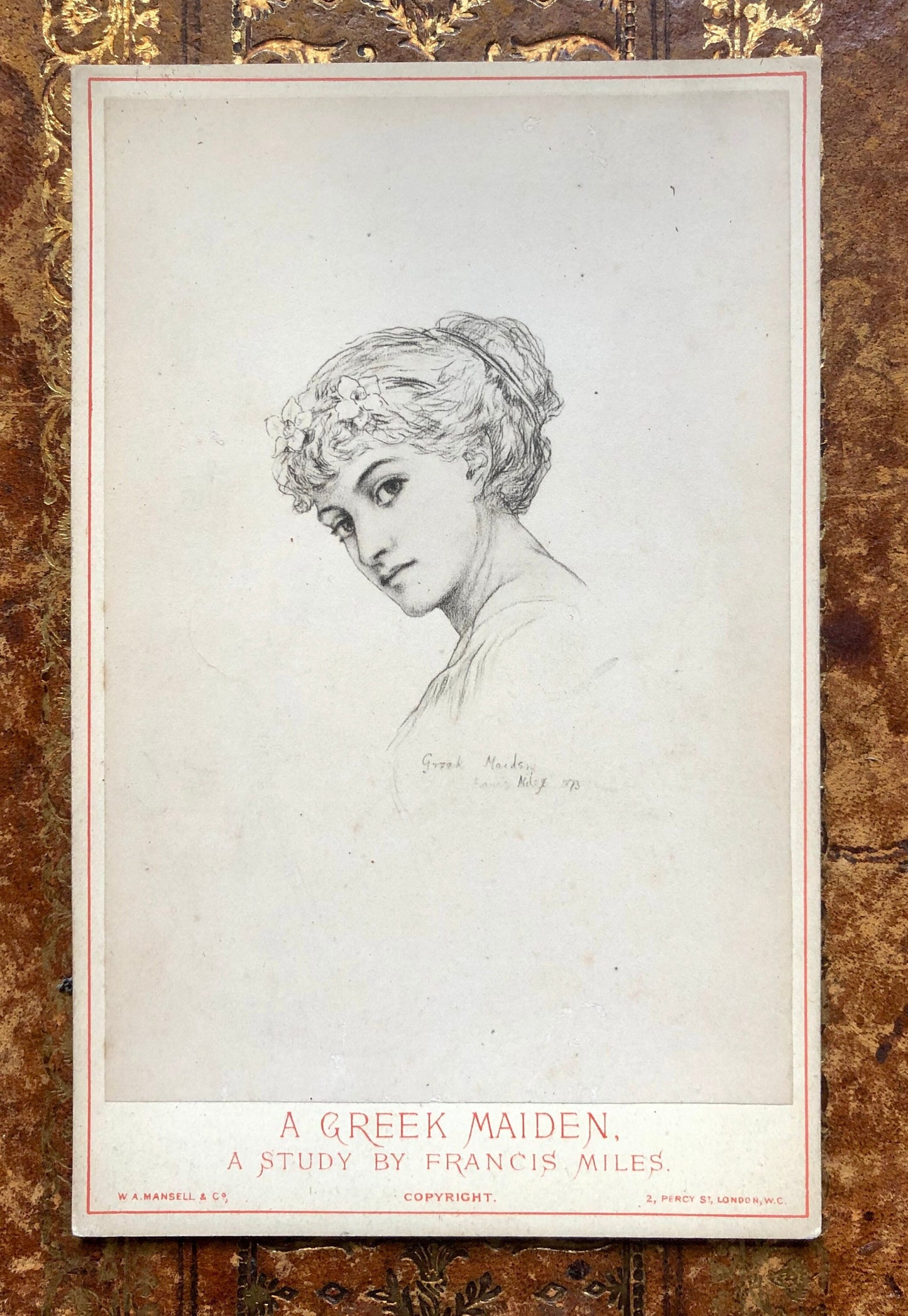 May include: A black and white drawing of a woman with a flower crown, titled "A Greek Maiden. A Study by Francis Miles."