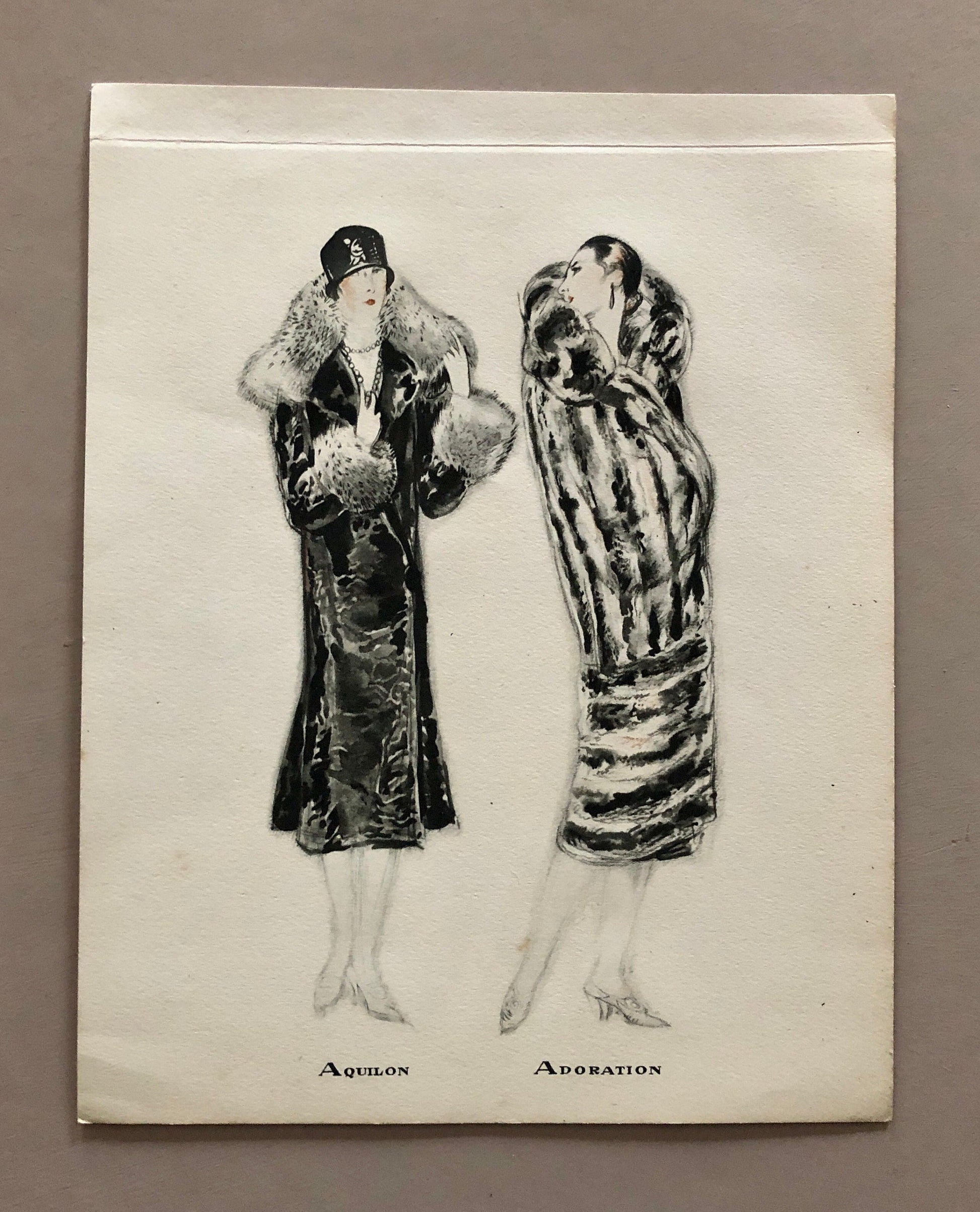 May include: Black and white illustration of two women wearing fur coats. The woman on the left is wearing a hat and the woman on the right is wearing a fur coat with a striped pattern. The text "Aquilon" and "Adoration" is written below the women.